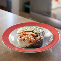 Meal ready to defrost inside a colorful plate