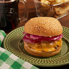 Homemade burger served with fries