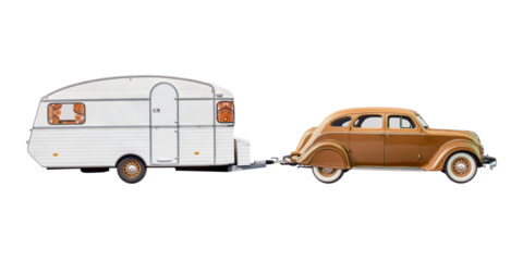 Vintage brown luxury classic car with old white caravan