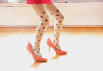 Young Girl Wearing Oversized High Heels Shoes, Low Section
