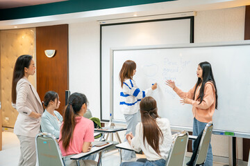 A group of women are in a classroom setting