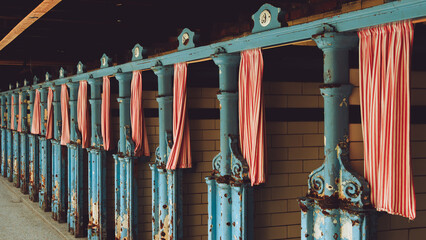 Ornate cast iron changing room cubicles in a Victoria swimming baths