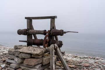Fototapeta premium Winch on the shoreline near water's edge
