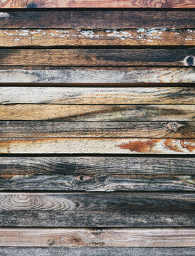 Full frame rustic strips of weathered wood siding
