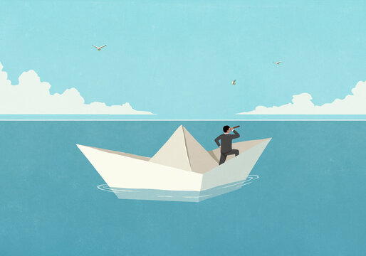 Businessman with spyglass telescope floating on paper boat on ocean
