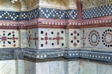 Details at facade of Genoa Cathedral or Metropolitan Cathedral of Saint Lawrence in Genoa, Italy.