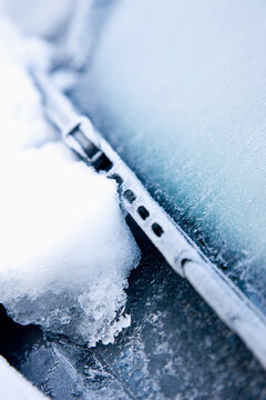 Close up of snow and ice on a car windscreen
