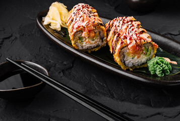 Gourmet tempura sushi roll with spicy sauce