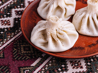 Traditional georgian khinkali on rustic plate