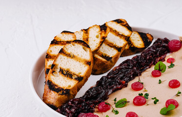 Gourmet chicken liver pate with berry compote and grilled bread
