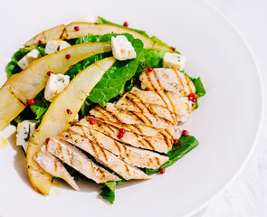 Fresh grilled chicken salad with pear and feta cheese