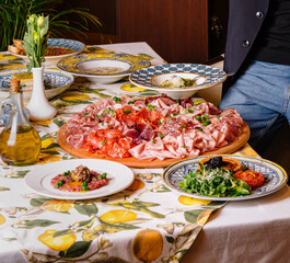 Man enjoying a feast of italian dishes