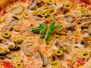 Freshly baked mushroom and olive pizza
