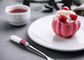 Elegant pink dessert with berries on plate