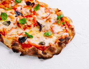 Fresh baked margherita pizza on white background