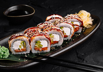 Delectable sushi roll platter on dark background
