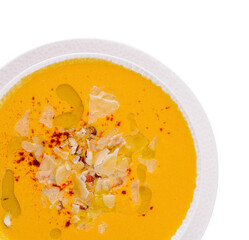 Homemade creamy pumpkin soup with toppings