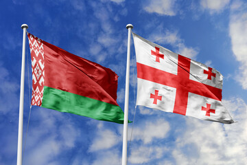 3d illustration. Belarus and Georgia Flag waving in sky. High detailed waving flag. 3D render. Waving in sky. Flags fluttered in the cloudy sky.