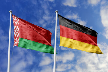 3d illustration. Belarus and Germany Flag waving in sky. High detailed waving flag. 3D render. Waving in sky. Flags fluttered in the cloudy sky.
