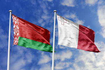 3d illustration. Belarus and Malta Flag waving in sky. High detailed waving flag. 3D render. Waving in sky. Flags fluttered in the cloudy sky.