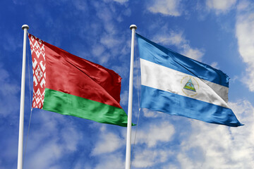 3d illustration. Belarus and Nicaragua Flag waving in sky. High detailed waving flag. 3D render. Waving in sky. Flags fluttered in the cloudy sky.
