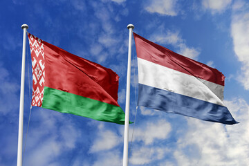 3d illustration. Belarus and Netherlands Flag waving in sky. High detailed waving flag. 3D render. Waving in sky. Flags fluttered in the cloudy sky.