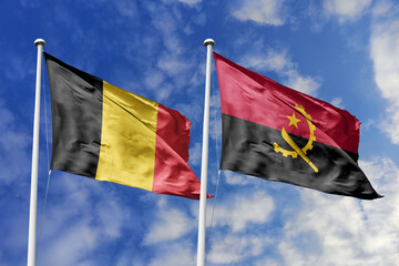 3d illustration. Belgium and Angola Flag waving in sky. High detailed waving flag. 3D render. Waving in sky. Flags fluttered in the cloudy sky.