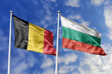 3d illustration. Belgium and Bulgaria Flag waving in sky. High detailed waving flag. 3D render. Waving in sky. Flags fluttered in the cloudy sky.