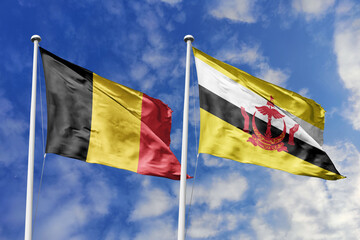 3d illustration. Belgium and Brunei Flag waving in sky. High detailed waving flag. 3D render....