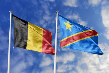 3d illustration. Belgium and Democratic Republic of the Congo Flag waving in sky. High detailed waving flag. 3D render. Waving in sky. Flags fluttered in the cloudy sky.