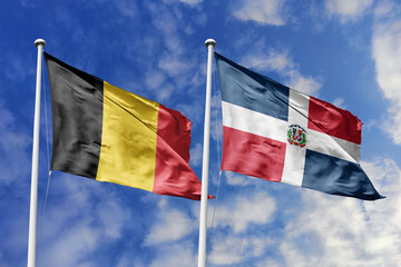 3d illustration. Belgium and Dominican Republic Flag waving in sky. High detailed waving flag. 3D render. Waving in sky. Flags fluttered in the cloudy sky.