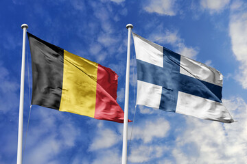 3d illustration. Belgium and Finland Flag waving in sky. High detailed waving flag. 3D render. Waving in sky. Flags fluttered in the cloudy sky.