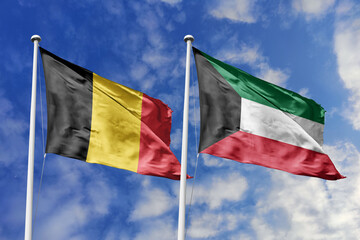 3d illustration. Belgium and Kuwait Flag waving in sky. High detailed waving flag. 3D render. Waving in sky. Flags fluttered in the cloudy sky.