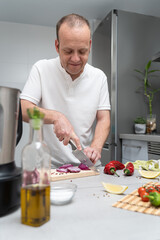 Fototapeta premium Cooking with Fresh Ingredients: Slicing Onions at Home