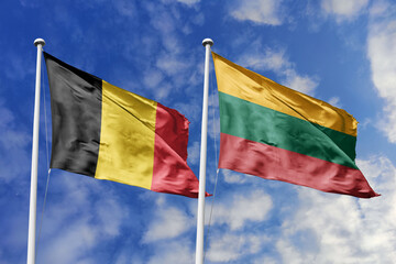 3d illustration. Belgium and Lithuania Flag waving in sky. High detailed waving flag. 3D render. Waving in sky. Flags fluttered in the cloudy sky.
