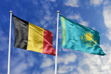 3d illustration. Belgium and Kazakhstan Flag waving in sky. High detailed waving flag. 3D render. Waving in sky. Flags fluttered in the cloudy sky.