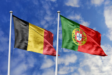 3d illustration. Belgium and Portugal Flag waving in sky. High detailed waving flag. 3D render. Waving in sky. Flags fluttered in the cloudy sky.