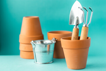 Gardening tools on a blue background with copy space.	