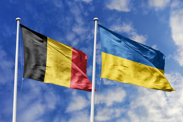 3d illustration. Belgium and Ukraine Flag waving in sky. High detailed waving flag. 3D render. Waving in sky. Flags fluttered in the cloudy sky.