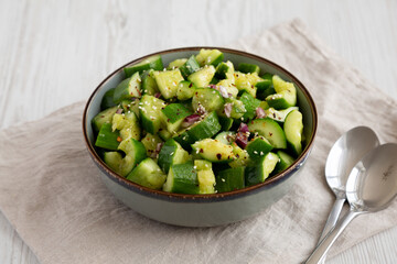 Homemade Smashed Cucumber Salad in a Bowl, side view.