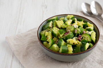 Homemade Smashed Cucumber Salad in a Bowl, side view. Copy space.