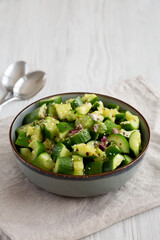 Homemade Smashed Cucumber Salad in a Bowl, side view.