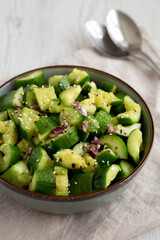 Homemade Smashed Cucumber Salad in a Bowl, side view.