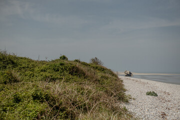 North French beach landscape with ruins of a bunker in the sea