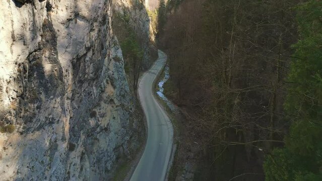 Drone over Bicaz Gorges Nature preserve with the beautiful curved road next to a river flowing