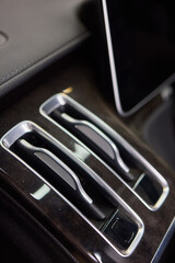 Closeup of car dashboard air vents near gear shift