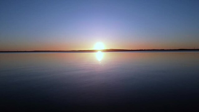 Gorgeous view of Lake Jamno in Poland during a golden sunset.