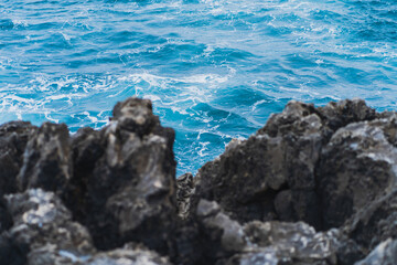 Rocky coast and azure ocean in Cascais Portugal.