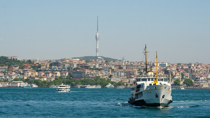 Fototapeta premium Passenger ship on the sea with Televisin Tower, buildings in İstanbul. Open space area. Selective focused.