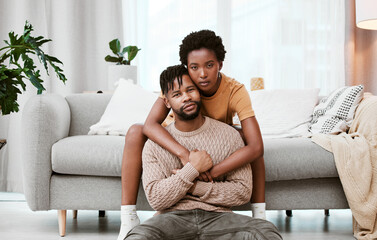 Portrait, black woman and man in living room, couple and hug for love, romance and relax in home...